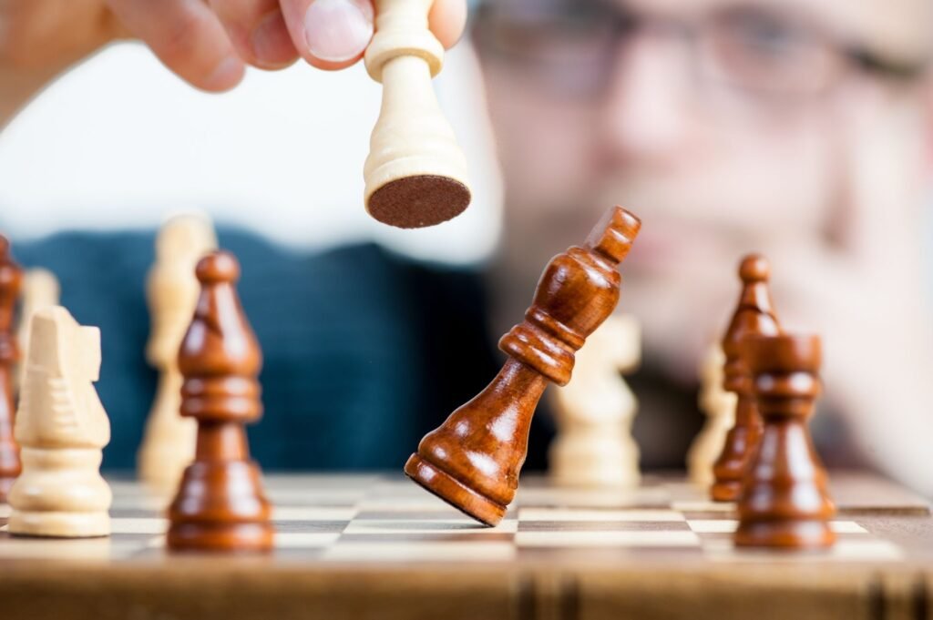 A chess player capturing the opponent's king piece, illustrating decisive counterplay in a competitive game