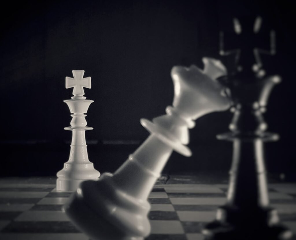 Black and white chess king pieces on a board, representing a critical plateau in chess improvement
