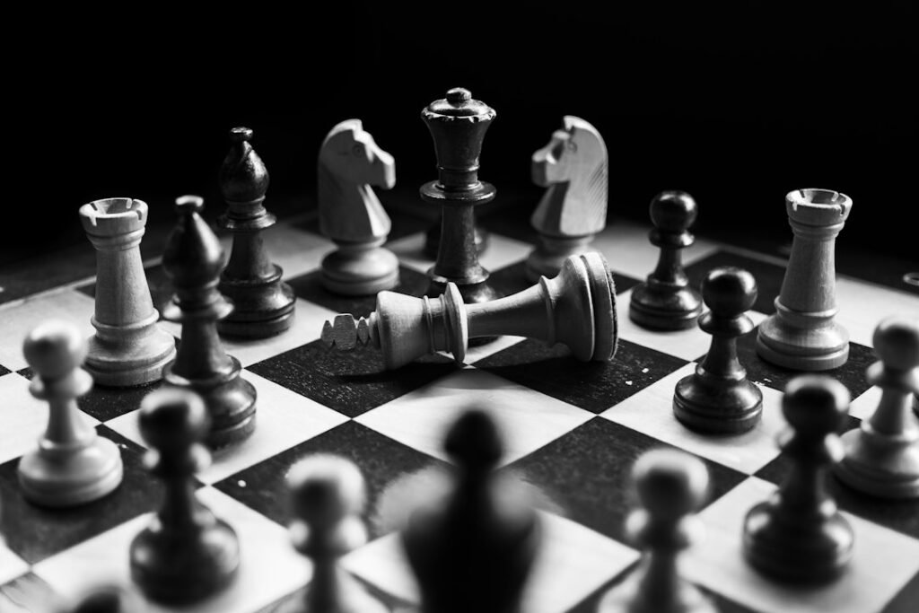 Chess board in a tense middlegame position with fallen king, illustrating London System strategy